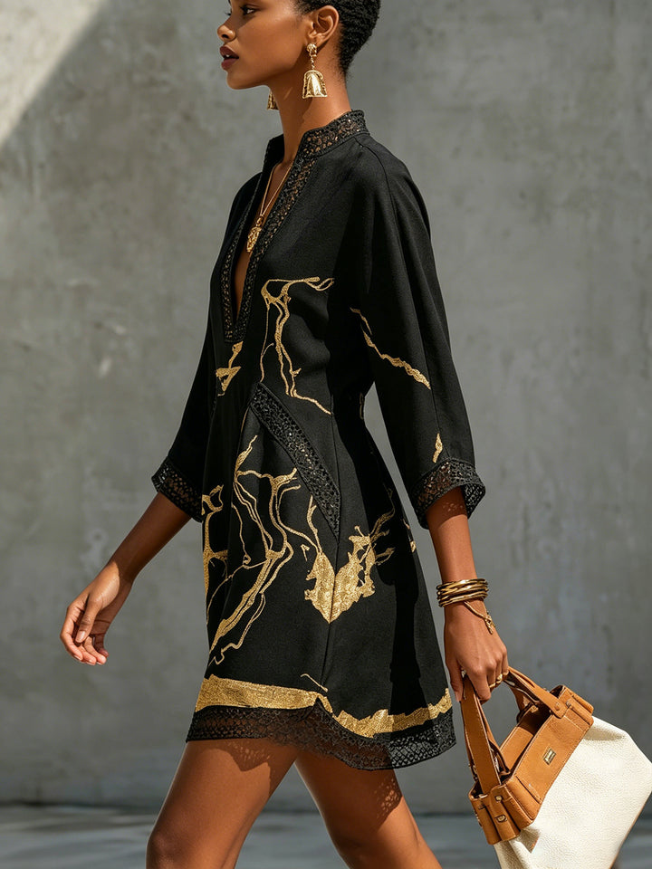 Donatella | Mini dress in black with golden marble print