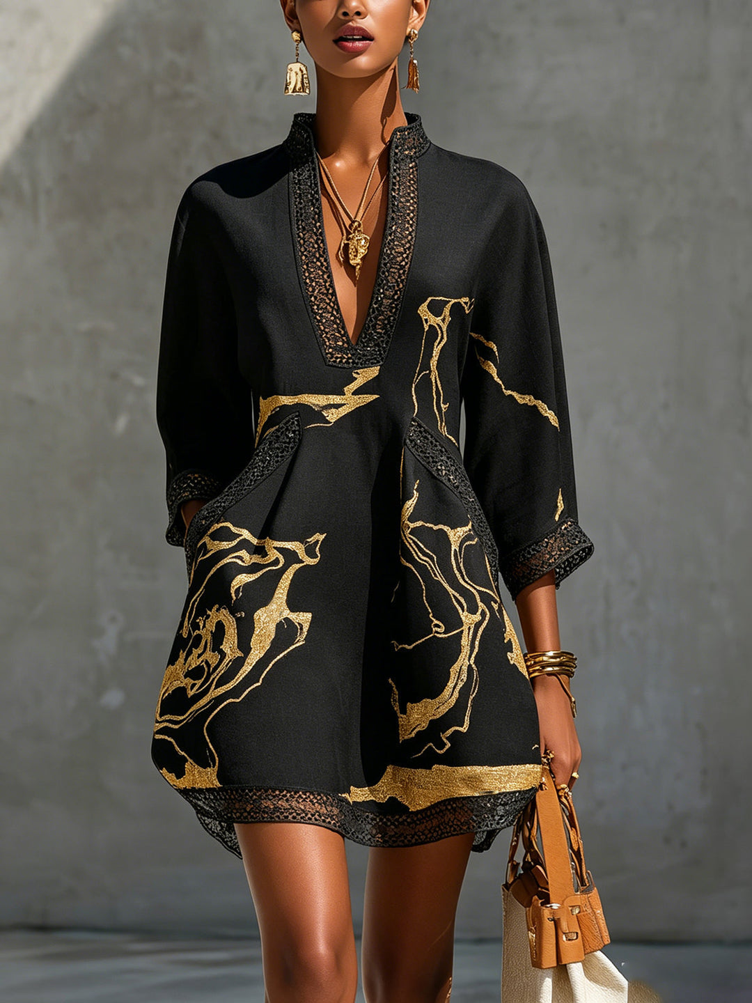 Donatella | Mini dress in black with golden marble print