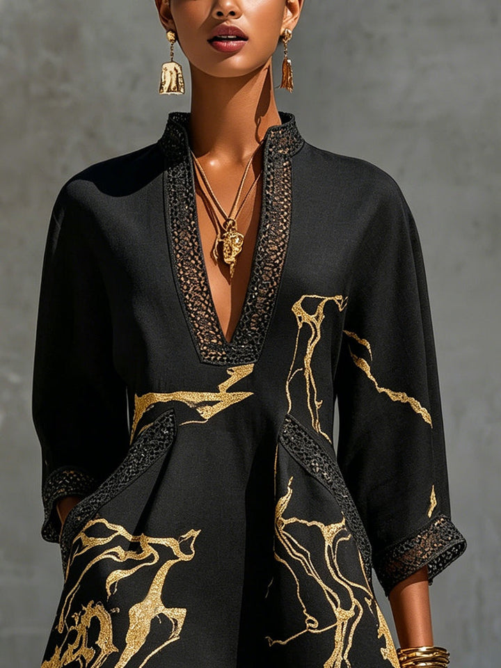 Donatella | Mini dress in black with golden marble print